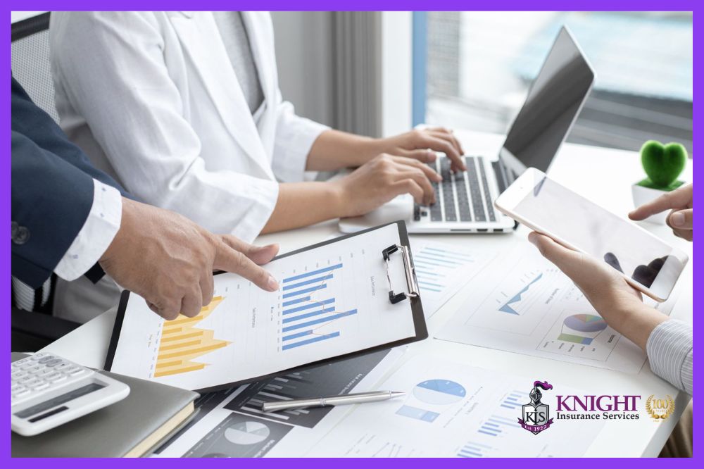Business professionals reviewing charts and data