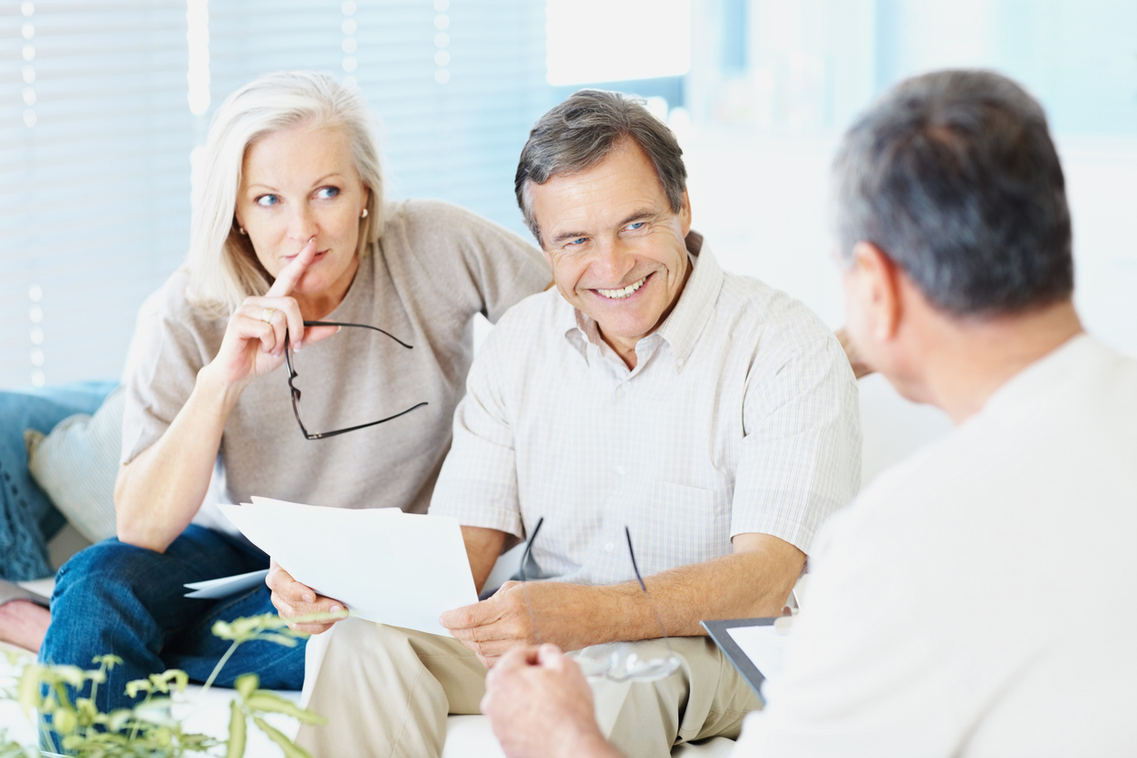 a happy elderly couple after face-to-face consultation