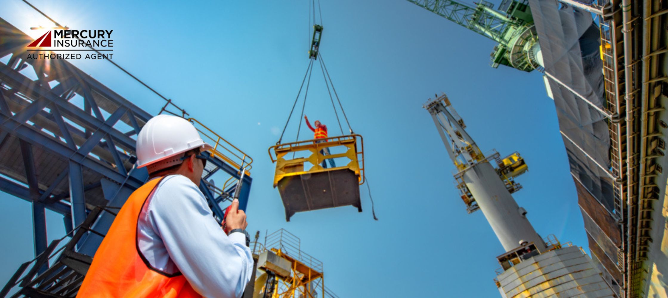 construction worker in a white hard hat and orange safety vest